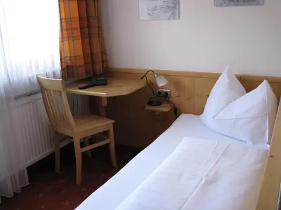 Ein Bett oder Betten in einem Zimmer der Unterkunft Apart Hotel Garni Strasser
