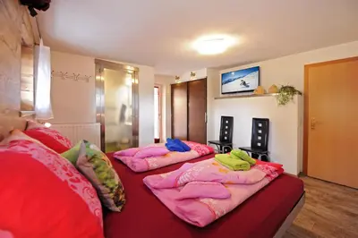 Ein Bett oder Betten in einem Zimmer der Unterkunft Apartment Rossbichl