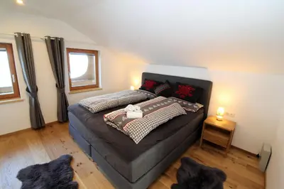 Ein Bett oder Betten in einem Zimmer der Unterkunft Alpenloft by Apartment Managers