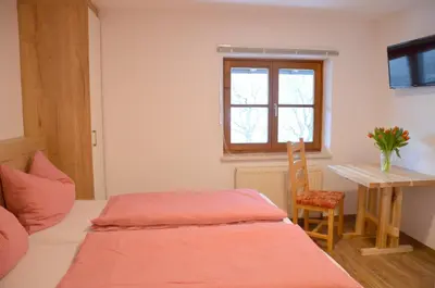 Ein Bett oder Betten in einem Zimmer der Unterkunft Rauwieslhof