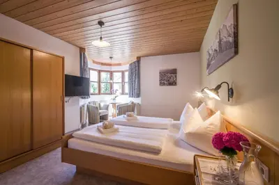 Ein Bett oder Betten in einem Zimmer der Unterkunft Gasthaus Kammerhof Angath