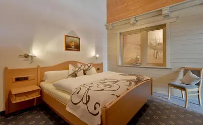 Ein Bett oder Betten in einem Zimmer der Unterkunft Appartementhaus Kostenzer