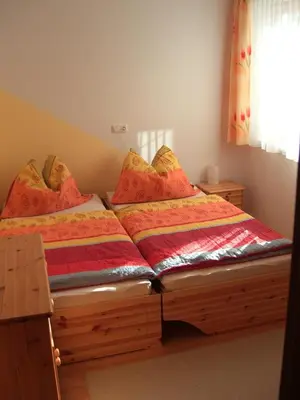 Ein Bett oder Betten in einem Zimmer der Unterkunft Apartment Neuhauser