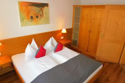Ein Bett oder Betten in einem Zimmer der Unterkunft Das Resort Brixen