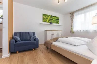 Ein Bett oder Betten in einem Zimmer der Unterkunft Haus Garten An der Sonne