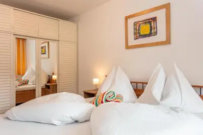 Ein Bett oder Betten in einem Zimmer der Unterkunft Haus Garten An der Sonne