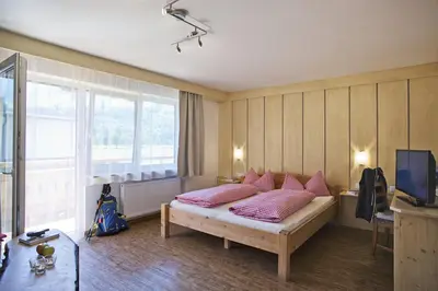 Ein Bett oder Betten in einem Zimmer der Unterkunft Alphotel Mittersill incl National Park Sommercard