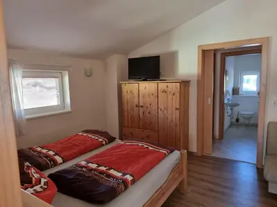 Ein Bett oder Betten in einem Zimmer der Unterkunft Das Taubenhaus