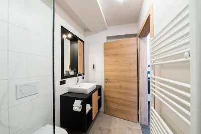 Ein Badezimmer in der Unterkunft Arthur's Hotel und Apartments am Achensee