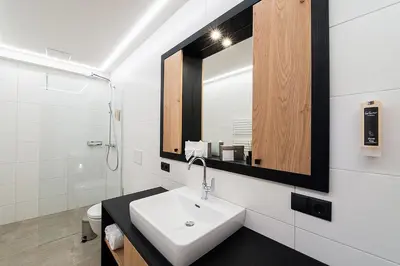 Ein Badezimmer in der Unterkunft Arthur's Hotel und Apartments am Achensee