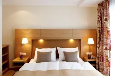 Ein Bett oder Betten in einem Zimmer der Unterkunft Sonnblick Apartments und Zimmer - Nationalpark Sommercard inklusive