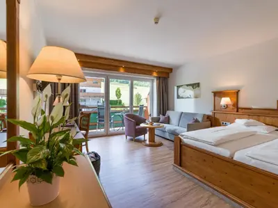 Ein Bett oder Betten in einem Zimmer der Unterkunft Hotel Der Wastlhof - direkt an der Skipiste Wellness & Spa