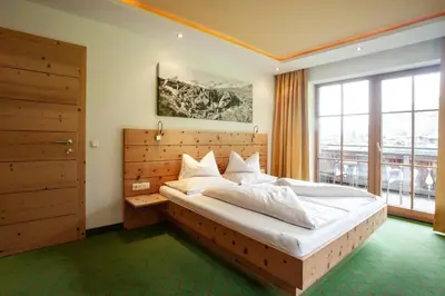 Ein Bett oder Betten in einem Zimmer der Unterkunft Naturresort Senningerhof