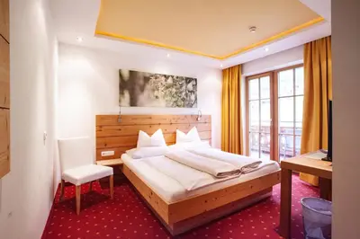 Ein Bett oder Betten in einem Zimmer der Unterkunft Naturresort Senningerhof