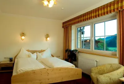 Ein Bett oder Betten in einem Zimmer der Unterkunft Hotel Gut Kramerhof
