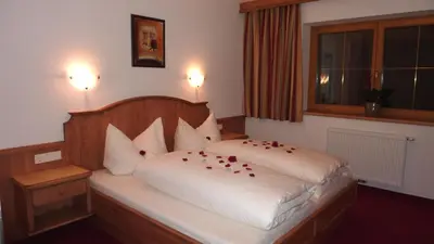 Ein Bett oder Betten in einem Zimmer der Unterkunft Ferienhof Nogler