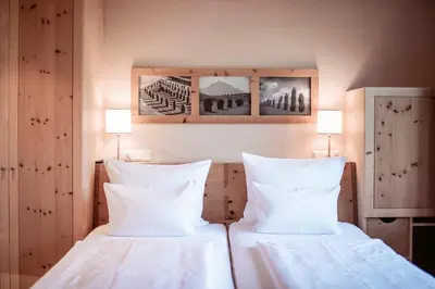 Ein Bett oder Betten in einem Zimmer der Unterkunft Gästehaus Bramböck