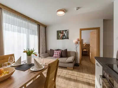 Ein Sitzbereich in der Unterkunft Echt Woods Appartements