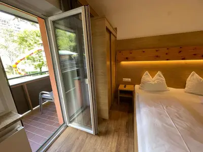 Ein Bett oder Betten in einem Zimmer der Unterkunft Pension Ahorn