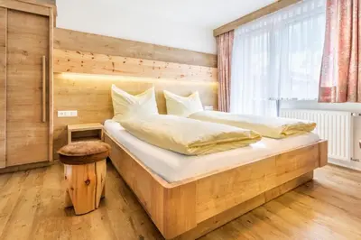 Ein Bett oder Betten in einem Zimmer der Unterkunft Pension Ahorn