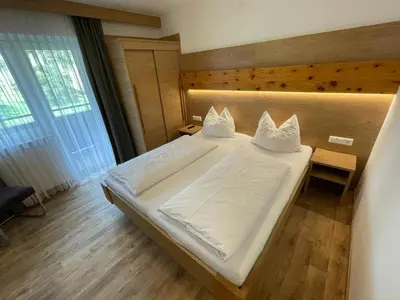 Ein Bett oder Betten in einem Zimmer der Unterkunft Pension Ahorn