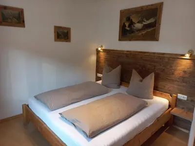 Ein Bett oder Betten in einem Zimmer der Unterkunft Scheffauerhof