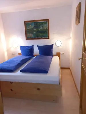 Ein Bett oder Betten in einem Zimmer der Unterkunft Scheffauerhof