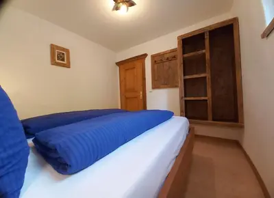 Ein Bett oder Betten in einem Zimmer der Unterkunft Scheffauerhof