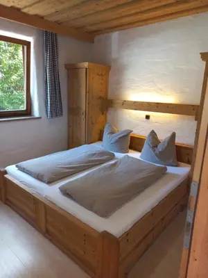 Ein Bett oder Betten in einem Zimmer der Unterkunft Scheffauerhof