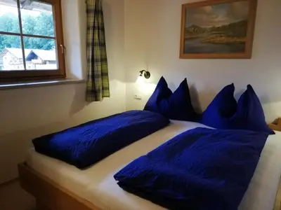 Ein Bett oder Betten in einem Zimmer der Unterkunft Scheffauerhof