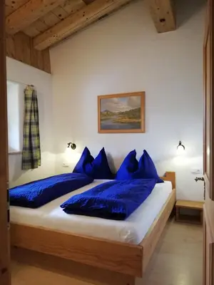 Ein Bett oder Betten in einem Zimmer der Unterkunft Scheffauerhof
