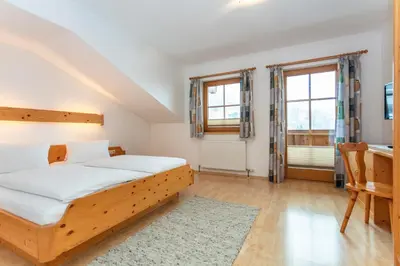 Ein Bett oder Betten in einem Zimmer der Unterkunft Tischlerwirt