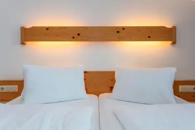 Ein Bett oder Betten in einem Zimmer der Unterkunft Tischlerwirt