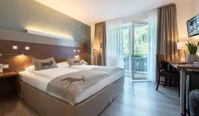 Ein Bett oder Betten in einem Zimmer der Unterkunft Hotel Residenz Hochalm - inklusive Joker Card im Sommer