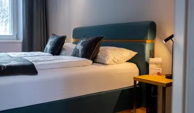 Ein Bett oder Betten in einem Zimmer der Unterkunft Hotel Residenz Hochalm - inklusive Joker Card im Sommer