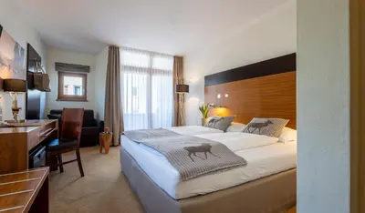 Ein Bett oder Betten in einem Zimmer der Unterkunft Hotel Residenz Hochalm - inklusive Joker Card im Sommer