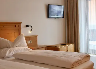 Ein Bett oder Betten in einem Zimmer der Unterkunft Pension Norika