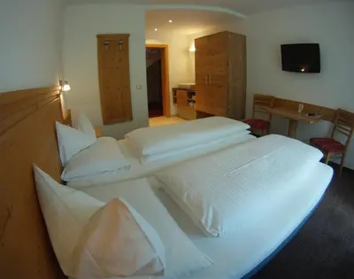 Ein Bett oder Betten in einem Zimmer der Unterkunft Pension Norika