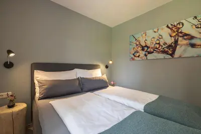 Ein Bett oder Betten in einem Zimmer der Unterkunft Feriendorf Wallenburg