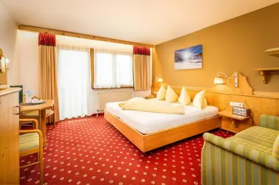 Ein Bett oder Betten in einem Zimmer der Unterkunft Alpen Wohlfühlhotel Dörflwirt