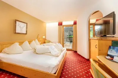Ein Bett oder Betten in einem Zimmer der Unterkunft Alpen Wohlfühlhotel Dörflwirt