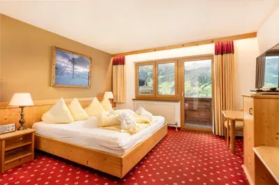 Ein Bett oder Betten in einem Zimmer der Unterkunft Alpen Wohlfühlhotel Dörflwirt