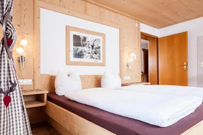 Ein Bett oder Betten in einem Zimmer der Unterkunft Apart Tyrol