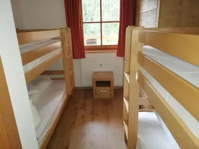 Ein Bett oder Betten in einem Zimmer der Unterkunft Astn Hütten Residenz Waldsicht Königsleiten - Ferienwohnungen