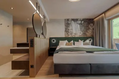 Ein Bett oder Betten in einem Zimmer der Unterkunft Hotel Jörglerhof