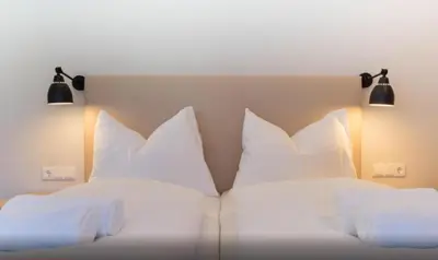 Ein Bett oder Betten in einem Zimmer der Unterkunft Kitzbuheler Alpen Penthouse Hollersbach
