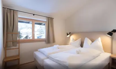 Ein Bett oder Betten in einem Zimmer der Unterkunft Kitzbuheler Alpen Penthouse Hollersbach