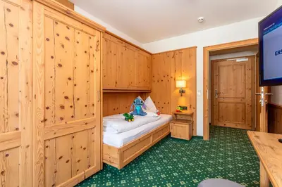 Ein Bett oder Betten in einem Zimmer der Unterkunft Hotel Bichlingerhof