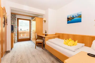 Ein Bett oder Betten in einem Zimmer der Unterkunft Hotel Bichlingerhof