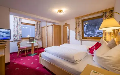 Ein Bett oder Betten in einem Zimmer der Unterkunft Hotel Bichlingerhof